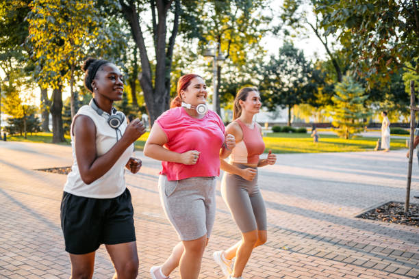 istock Three Young Female Friends Jogging In The Park 1688584437