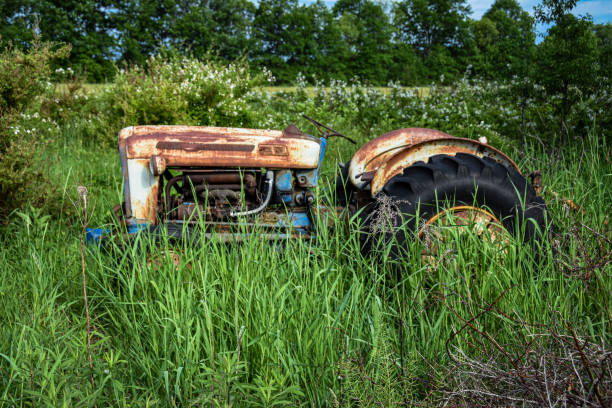 istock Old used tractor in the weeds 1688587721