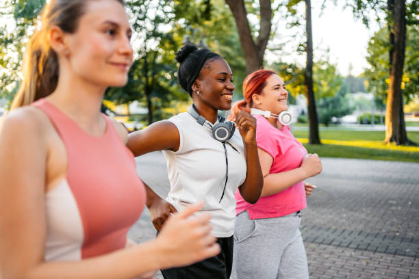 istock Three Young Female Friends Jogging In The Park 1688590327