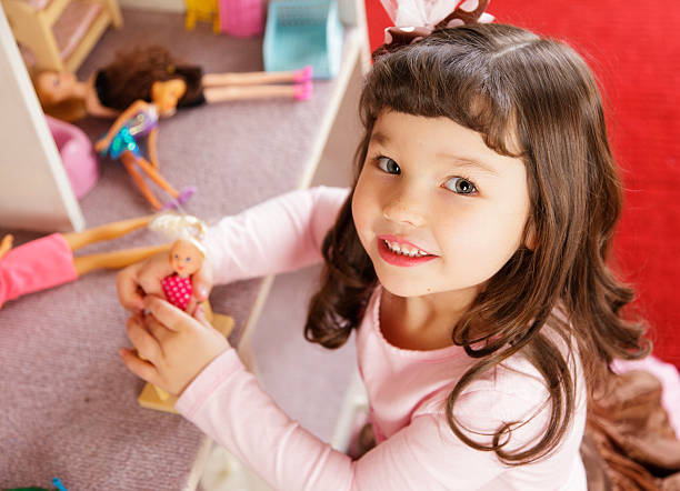 istock Little Girl with Dollhouse 168859229