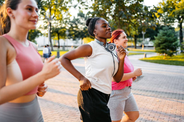 istock Three Young Female Friends Jogging In The Park 1688592457