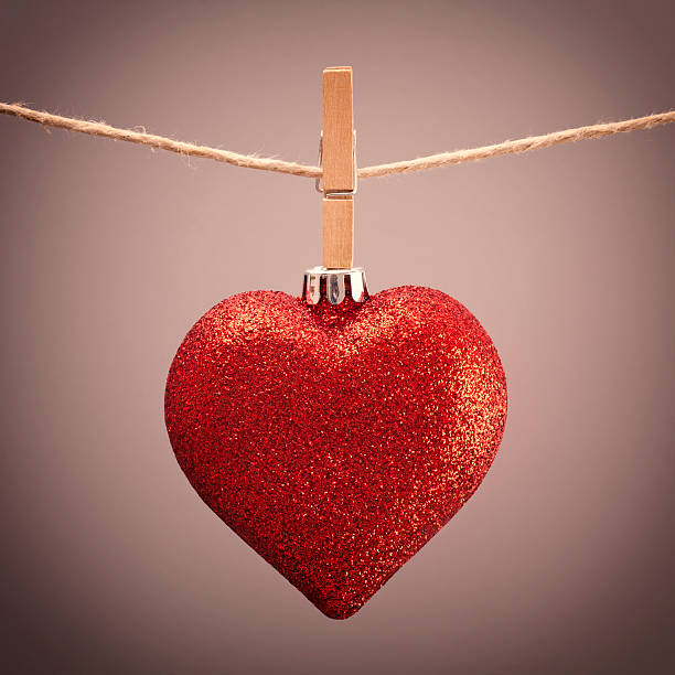 istock Red christmas heart hanging from clothesline 168859733