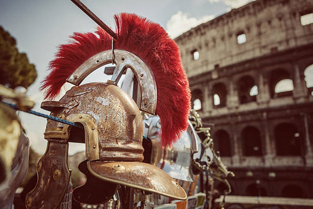 Roman Centurion Soldier Helmets and the Coliseum Roman Centurion Soldier Helmets in front of the Coliseum gladiator stock pictures, royalty-free photos & images