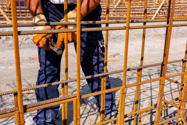 istock Construction worker binding rebar for reinforce concrete column at the building site. 1688602457