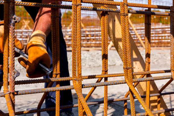 istock Construction worker binding rebar for reinforce concrete column at the building site. 1688604058