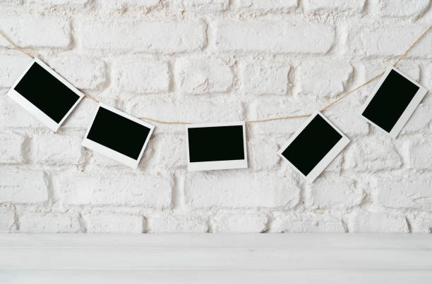 istock Blank photos hanging on a clothesline 1688646776