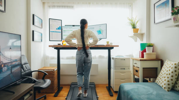 istock Woman with back pain working at standing desk home office 1688651234