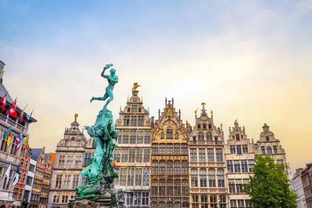 The Grote Markt with Brabo's Monument at the town square of Antwerp in Belgium. Beautiful and ancient flemish buildings at the background.
