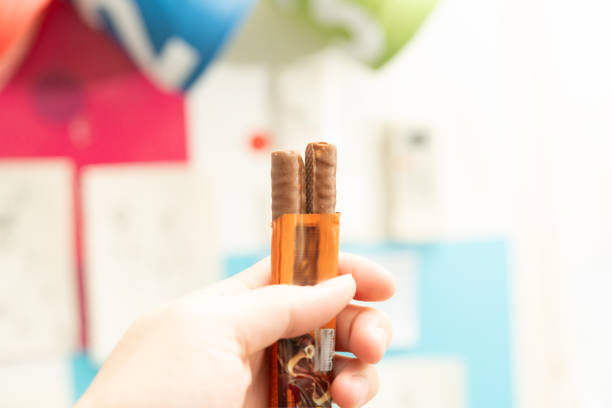 kid hand hold snack chocolate bar show ,close up