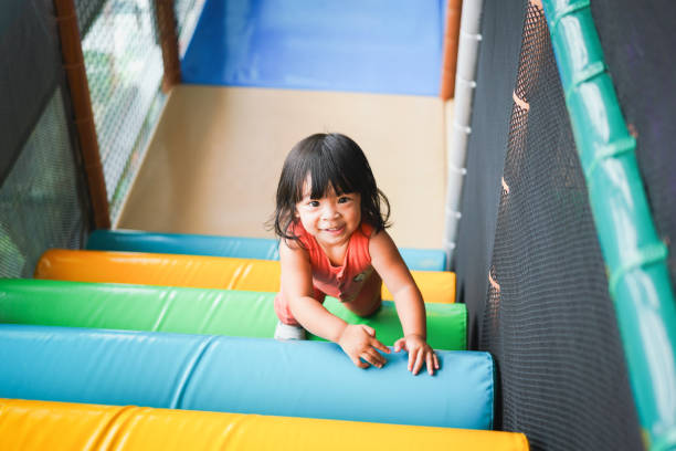 istock Cute girl is playing in kid fun park. 1688692690