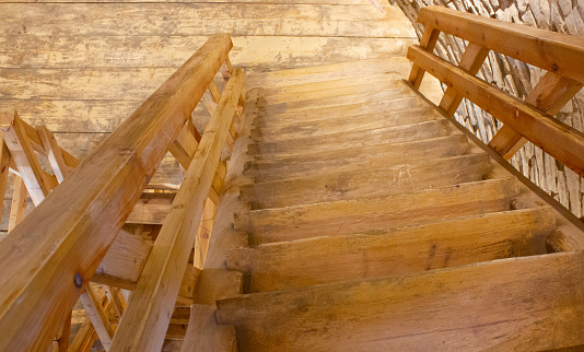 Staircase, steps made of wood. Wooden steps for ascent and descent.