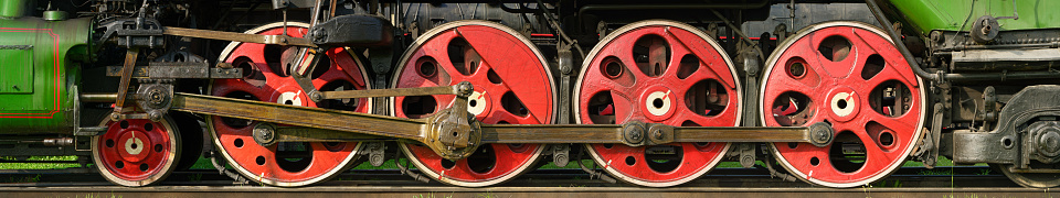 Nostalgic look back to a time long gone. \nA detail of the drive mechanism of a steam locomotive from the 1920s. Steam is released through a valve to lower the pressure in the boiler.