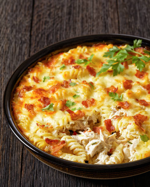 istock fusilli pasta bacon cheese chicken bake, top view 1688764345