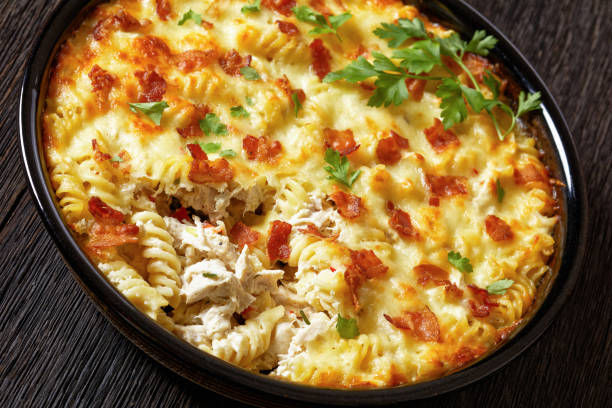 istock fusilli pasta bacon cheese chicken bake, top view 1688765953