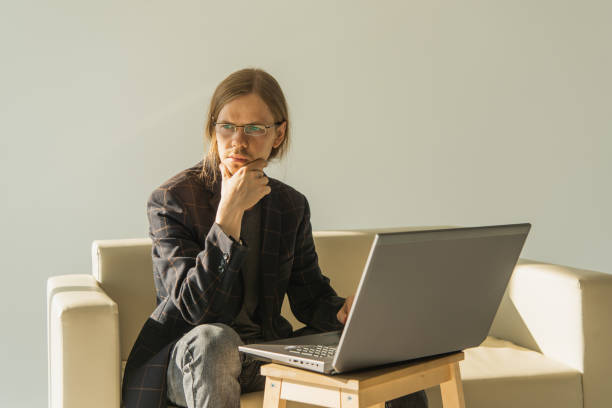 Young man working on laptop.