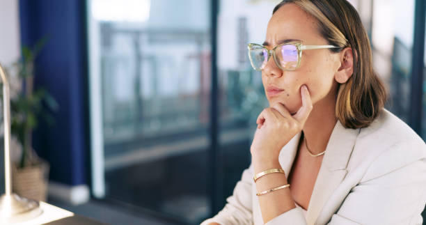 istock Thinking, business and woman with feedback, email and ideas with copywriting, planning and development. Person, employee or consultant with glasses, report and editor with question, confused or doubt 1688785270