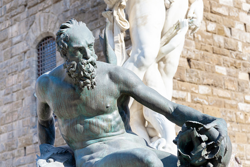 Firenze, Italy - 6 August 2023: statues of the Neptune fountain, in Piazza della Signoria