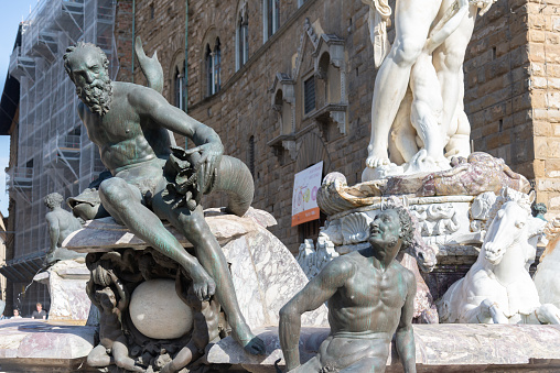 Firenze, Italy - 6 August 2023:statues of the Neptune fountain, in Piazza della Signoria