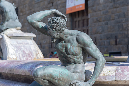 Firenze, Italy - 6 August 2023:statues of the Neptune fountain, in Piazza della Signoria