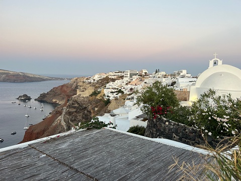 Beautiful famous view of the white town buildings\nThe amazing architecture of Oia in Santorini Island, The Greek islands