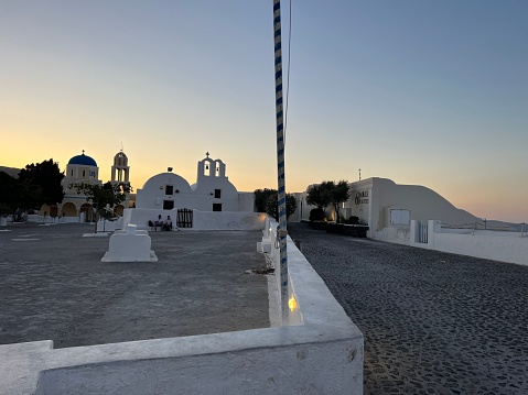 Beautiful famous view of the white town buildings\nThe amazing architecture of Oia in Santorini Island, The Greek islands