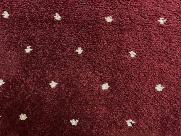 istock carpet red texture background with white dots. detailed texture of thick carpet fabric. 1688855287
