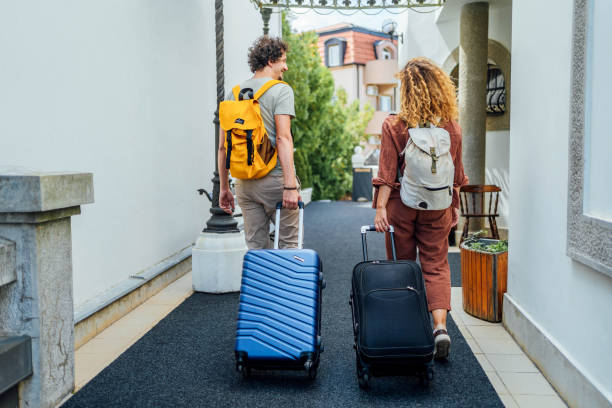 istock Couple with suitcases leaving the hotel 1688856406