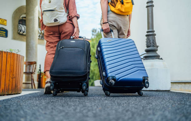 istock Couple with suitcases leaving the hotel 1688860985