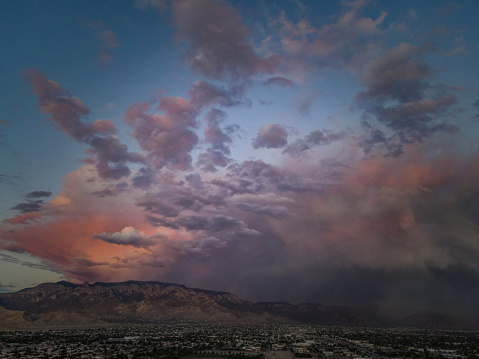 Sunrise panorama over the sonoran desert of Arizona with layers of mountains shot at altitude by a drone.