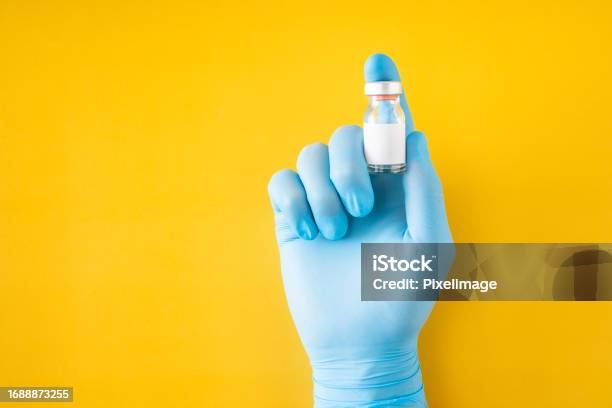 Doctors Hand Shows Vaccine Stock Photo - Download Image Now - Booster Dose, Coronavirus, Adult