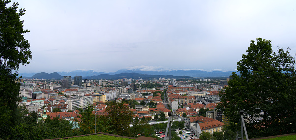 Aerial view of City of Ljubljana seen from Sance castle hill on a cloudy summer day. Photo taken August 9th, 2023, Ljubljana, Slovenia.