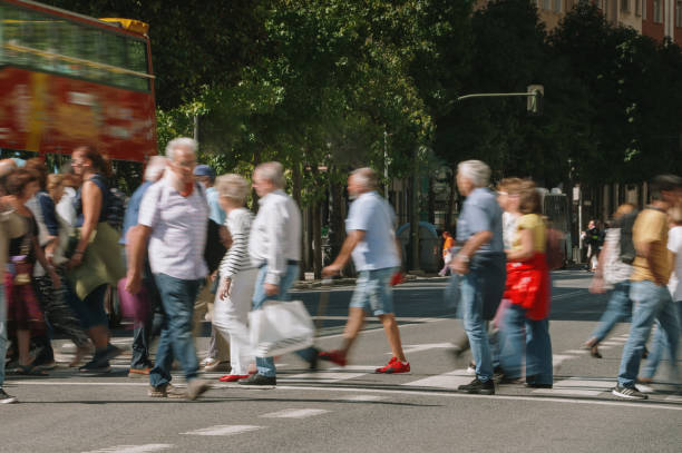 istock People in motion crossing a street 1688906930
