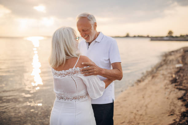 istock Senior couple by the sea 1688907642