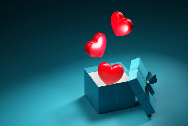 istock Red hearts floating out from gift box  with copy space. 1688912636