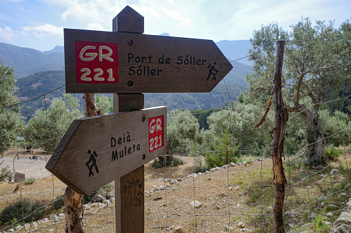 Port de Soller - 12 June, 2023: Signpost on the GR221 hiking trail in the Tramuntana mountains, Mallorca