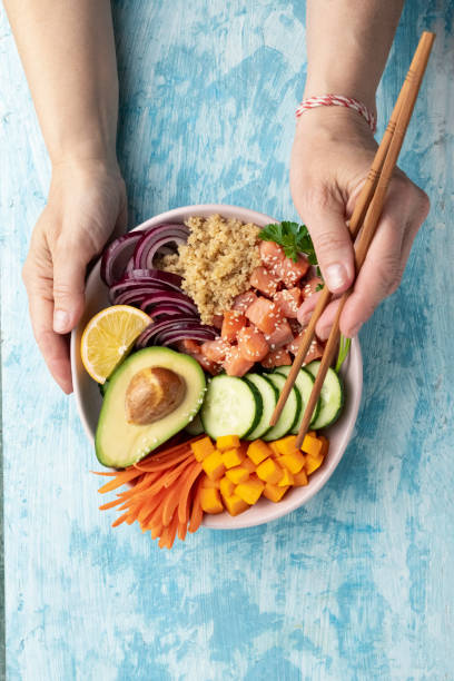 istock poke bowl salmon with quinoa and vegetables 1688914277