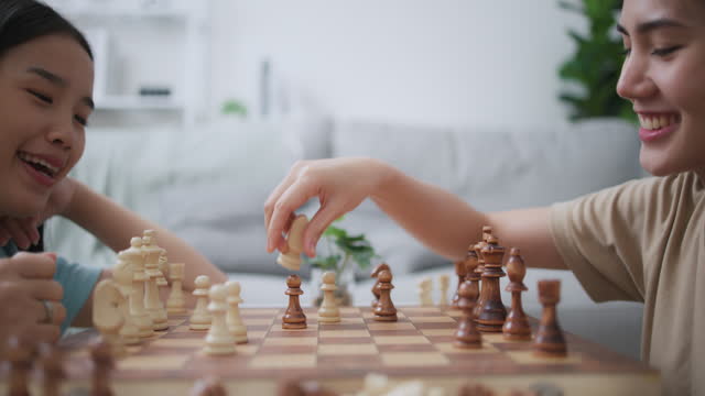 Woman Play Strategic Board Games with Friend, Enjoy Chess Competition at Home