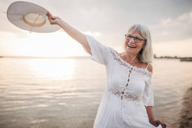 istock Senior woman by the sea 1688922066