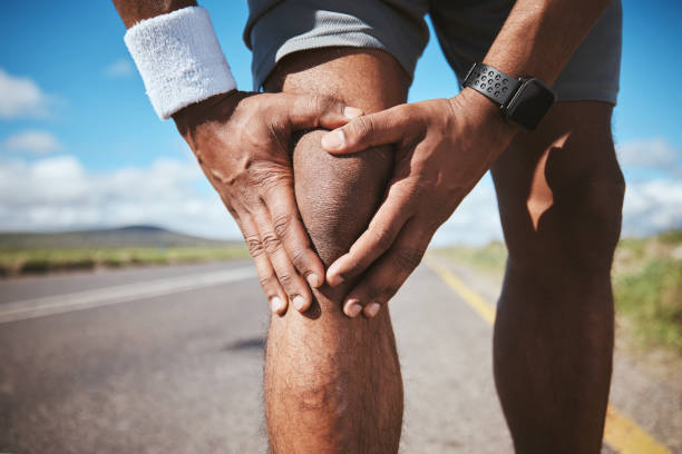 istock Knee pain, person hands and runner massage injury problem, broken bone and tired from exercise. Anatomy fatigue, burnout and closeup athlete sore from running, race training or sports cardio workout 1688922088