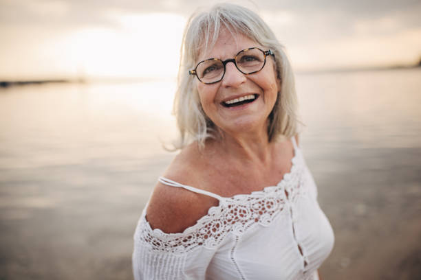 istock Old woman by the sea 1688922652