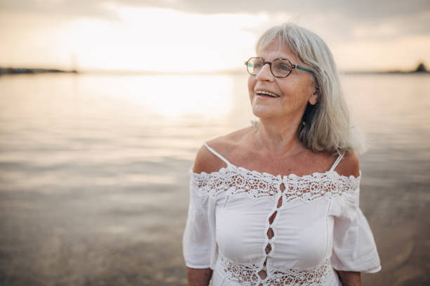 istock Old woman by the sea 1688923215