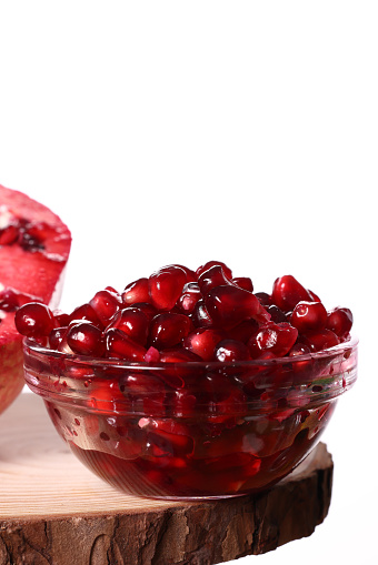 Pomegranate seeds in glass bowl