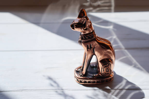 istock Egyptian cat statuette on white table. 1688954538