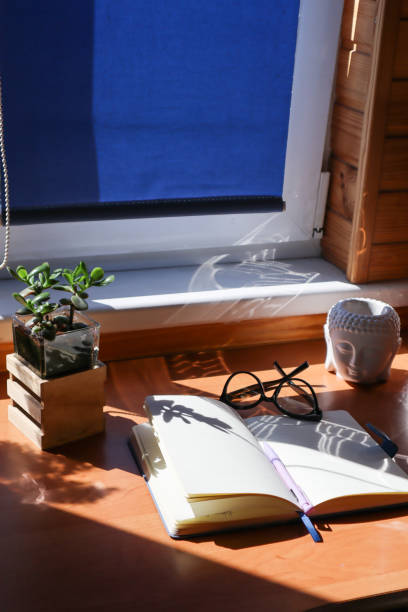 istock Opened notepad and spectacles on the table. The place of work. 1688955654