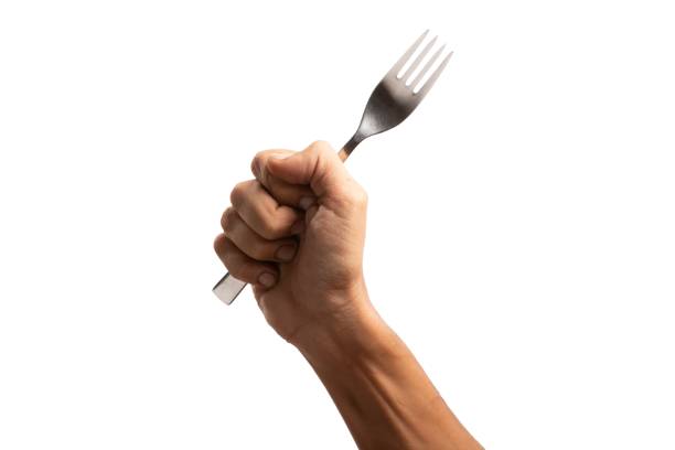 istock black male hand holding a silver fork on an isolated white background 1688966022