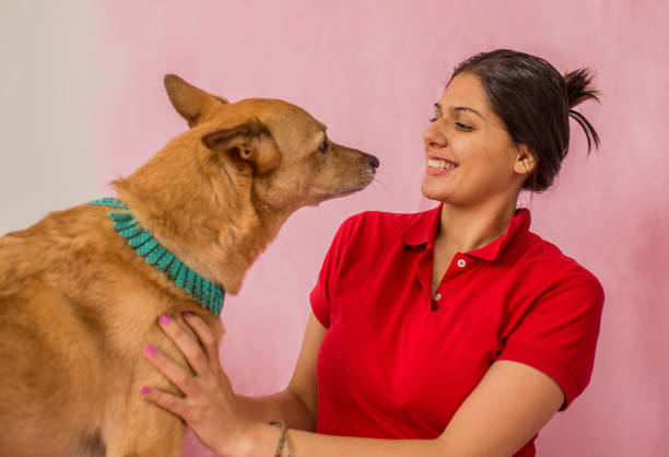 young woman with her pet smiling