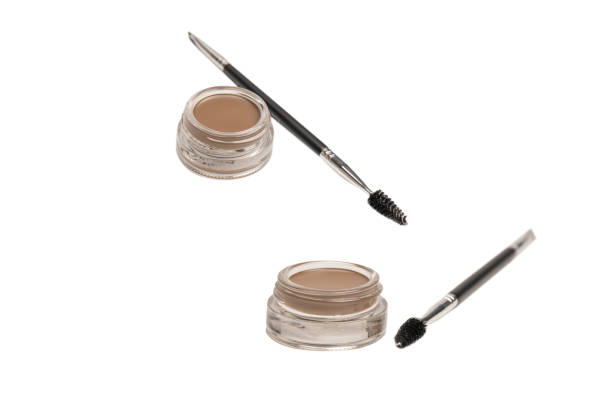 istock A brow pomade in blonde shade with brush isolated on a white background. 1689012278