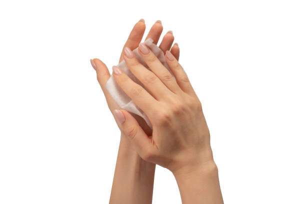 istock Wet wipe in a woman hand isolated on a white background. 1689012935