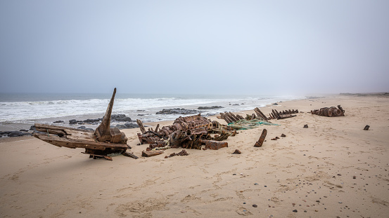 Benguela Eagle shipwreck, , which ran aground in 1973, on the C34-road between Henties Bay and Torra Bay in the Skeleton Coast area of Namibia.  Horizontal.