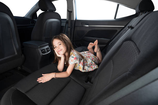 istock Kid lay in rear seat of auto 1689014850